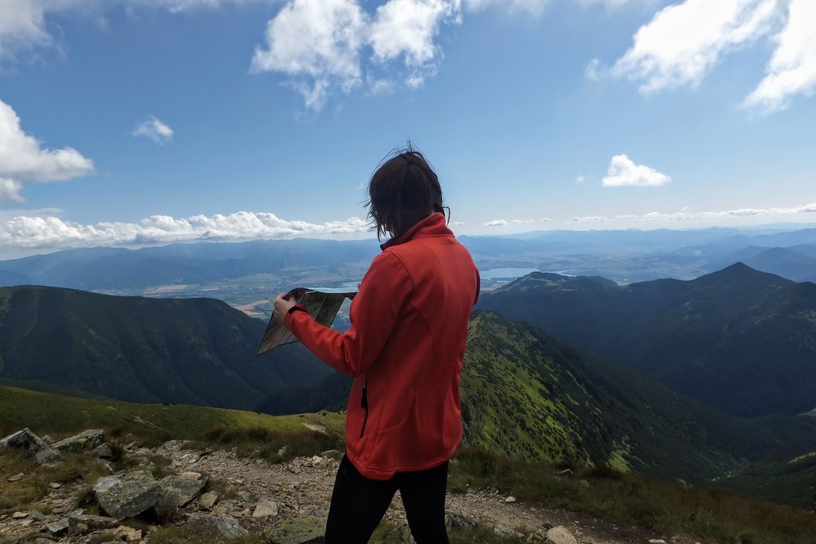 Reading a map while hiking in Western Tatra mountains, Slovakia